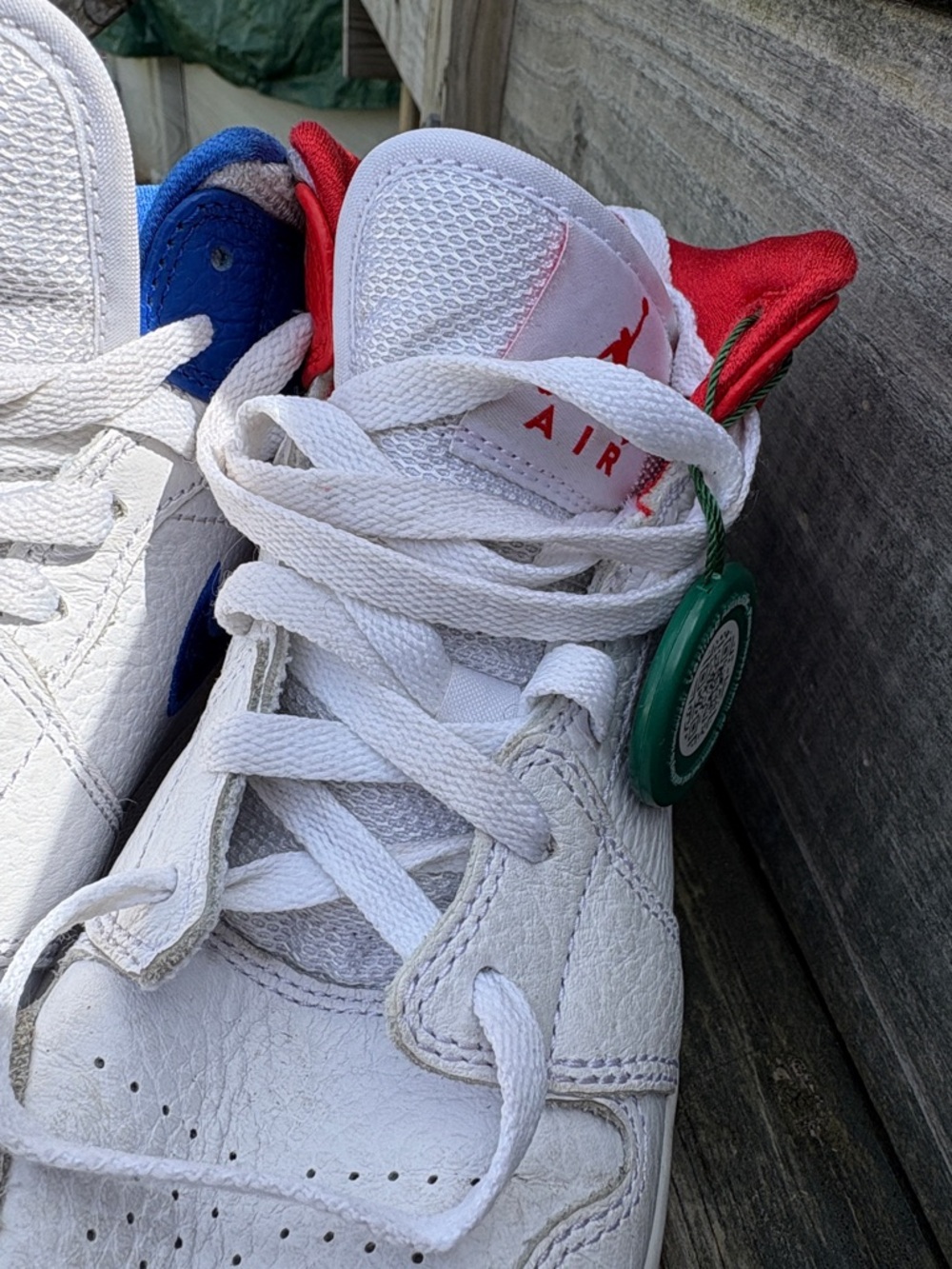 Nike Kids White Sneakers with Red and Blue Accents